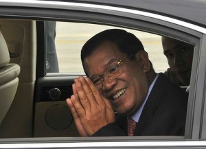 Prime Minister Hun Sen greets the press with a Sampeah gesture